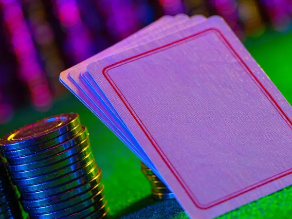 lucky777 Face-down playing cards beside colourful casino chips
